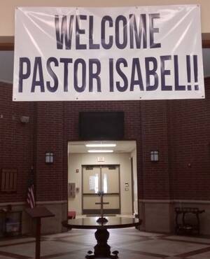 "Welcome Pastor Isabel" banner