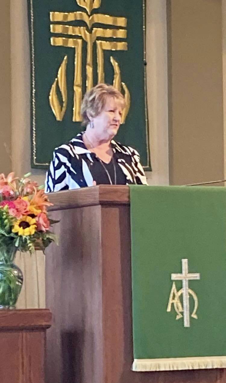 Ruling Elder Deborah Mathews delivering sermon