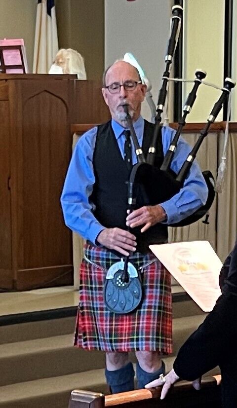 Commemorative service complete with bagpipes.