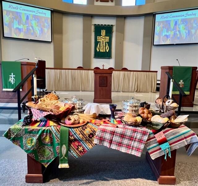 Picture of bountiful food on table for World Communion Sunday, 2023