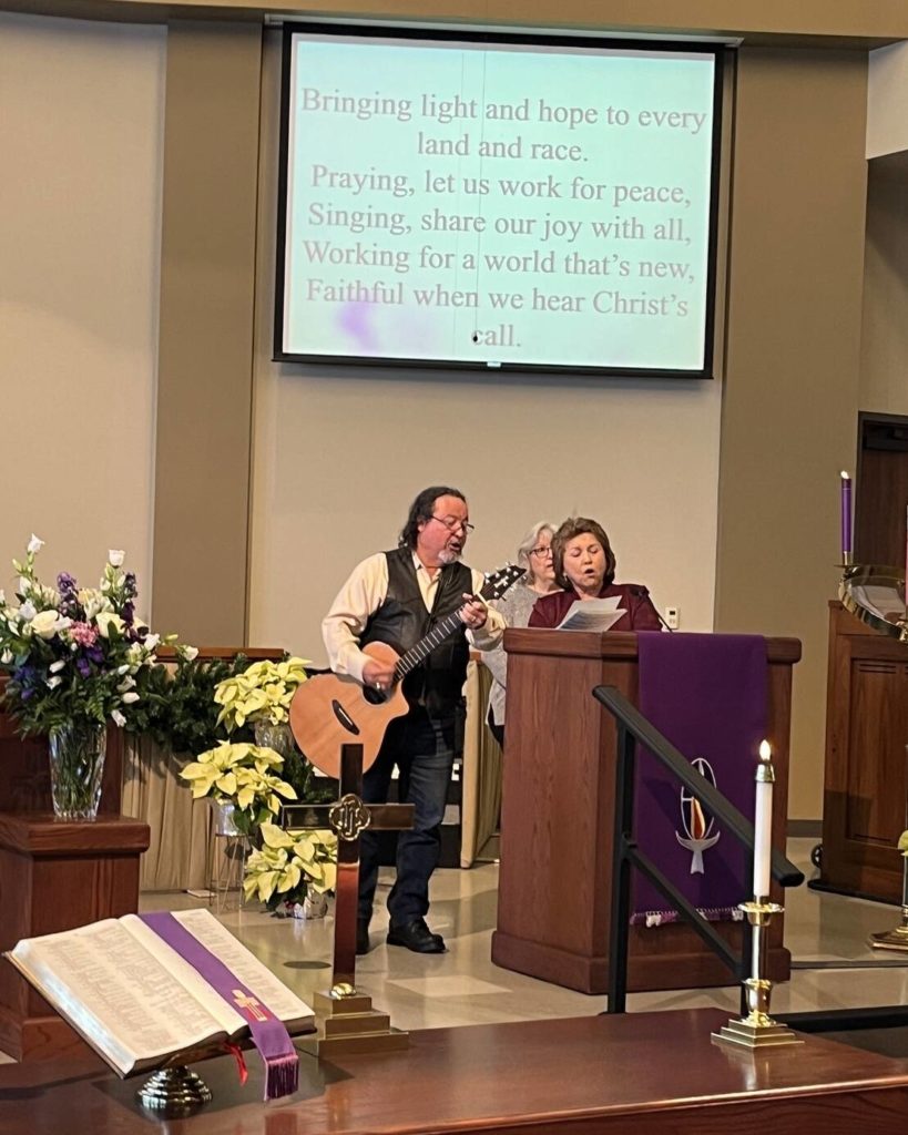 Pastor Isabel and husband Hector singing a duet