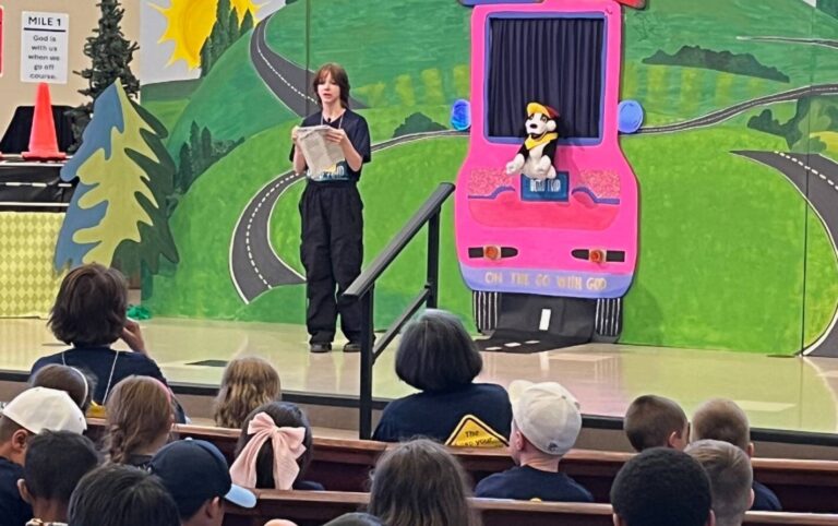 Narrator talking with Scott the dog puppet